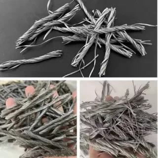 Twisted macro synthetic fiber strands, shown loose and held in the hand
